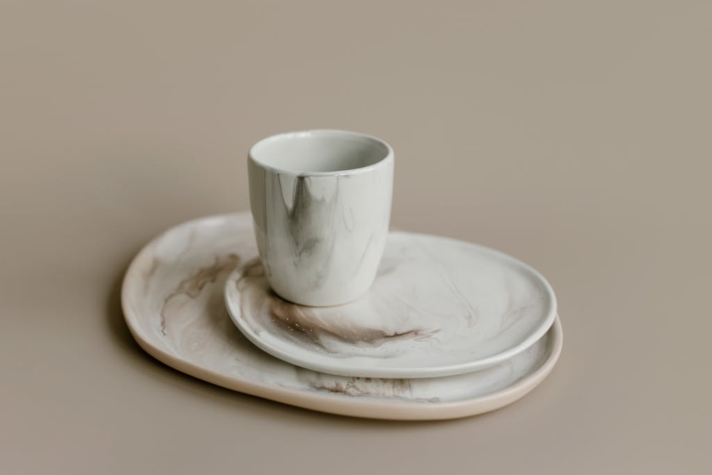 Close-up Photo of Ceramic Flatware and Cup
